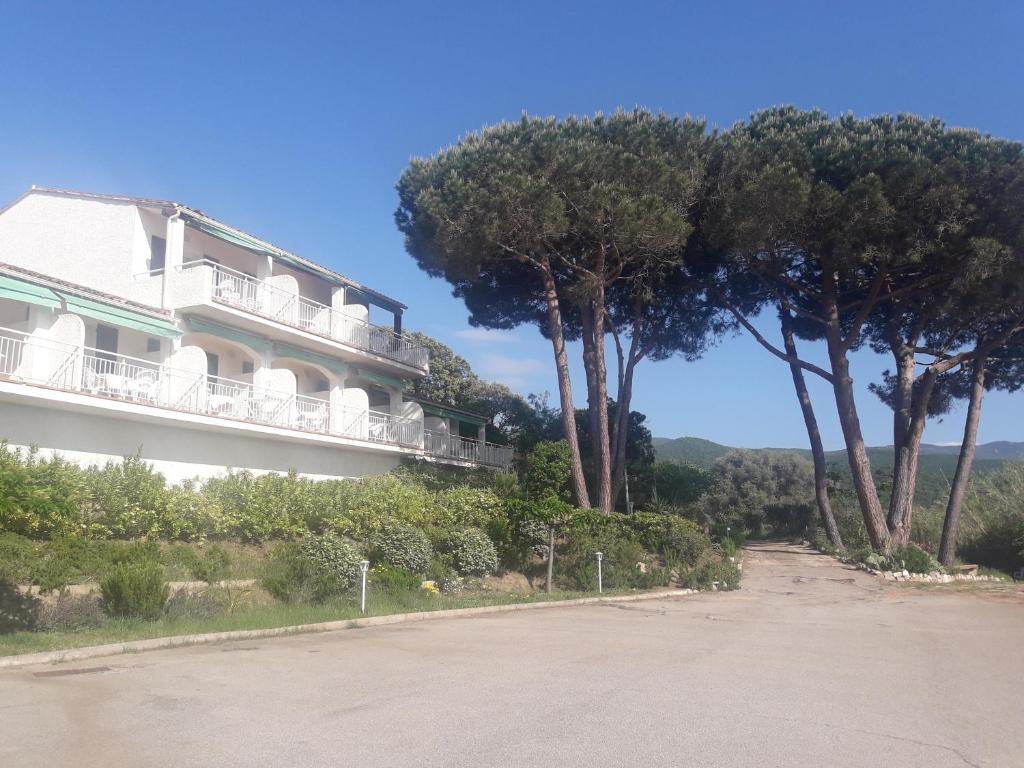 a building with trees on the side of a road at I Casetti in Molini