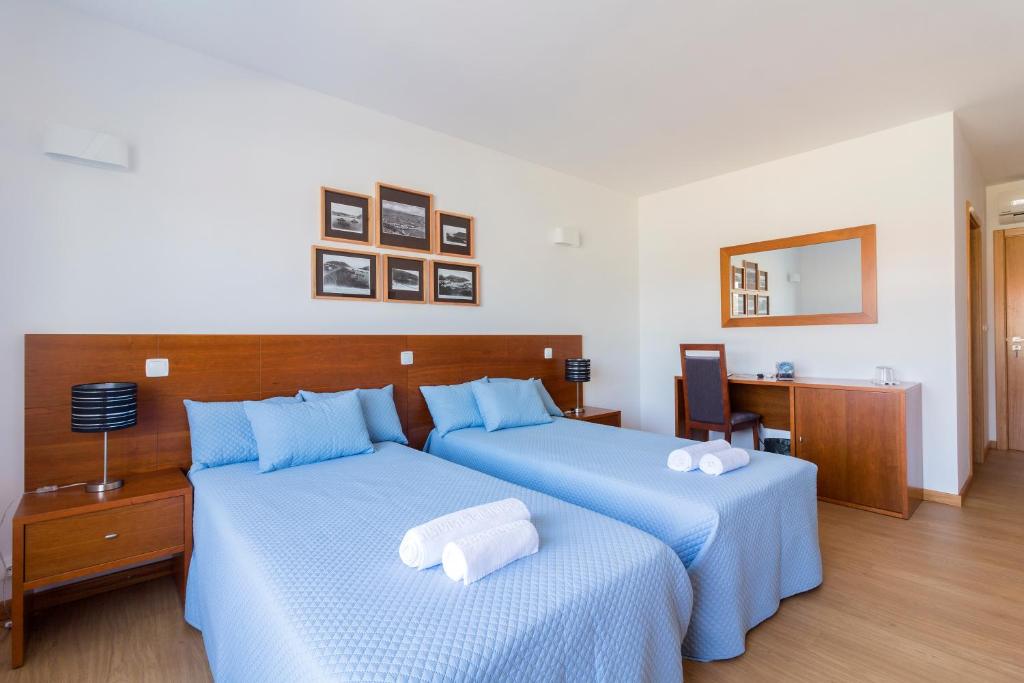 Postel nebo postele na pokoji v ubytování Monte da Guia