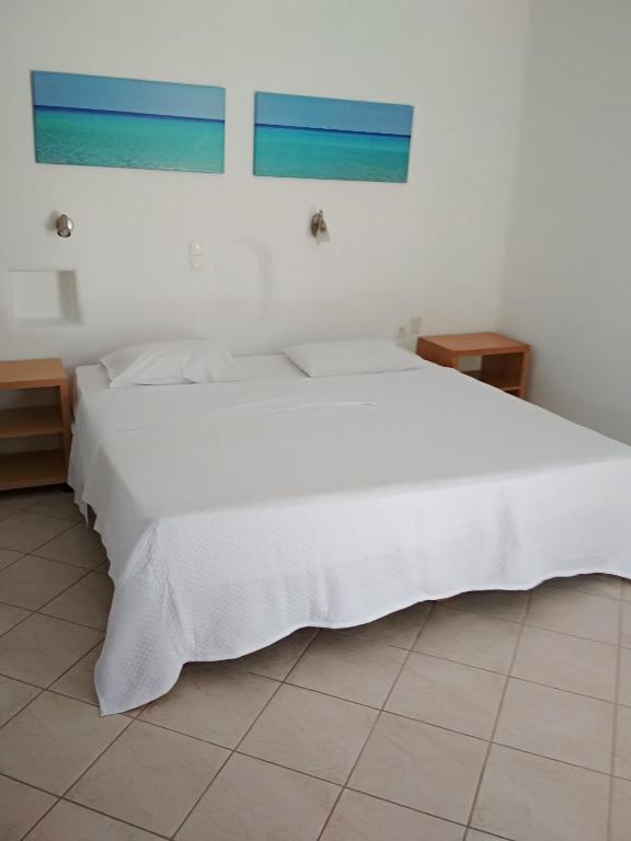 Postel nebo postele na pokoji v ubytování Sourmeli Garden Hotel