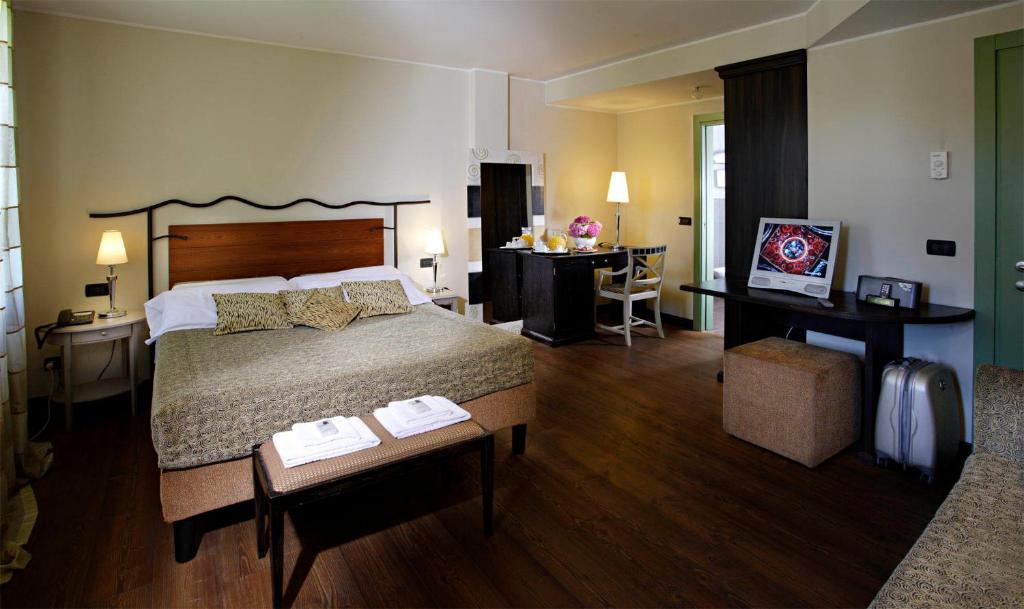 Postel nebo postele na pokoji v ubytování Hotel Fossa Mala
