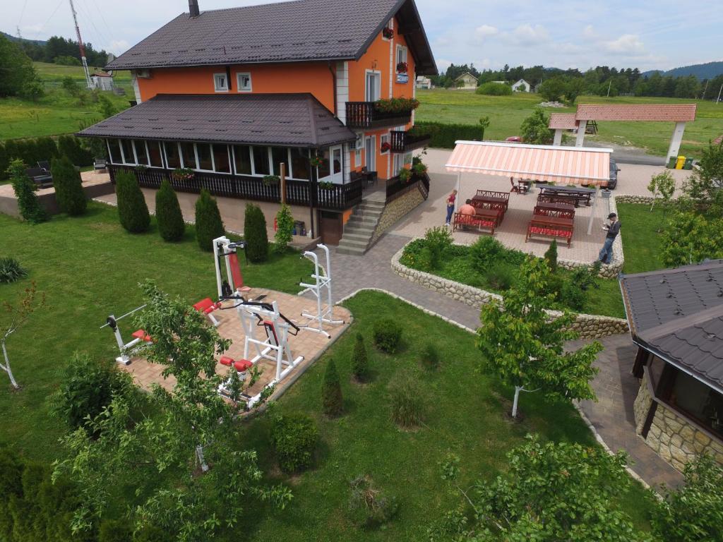an aerial view of a house with a garden and a playground at Plitvice Pension Perisic in Korenica