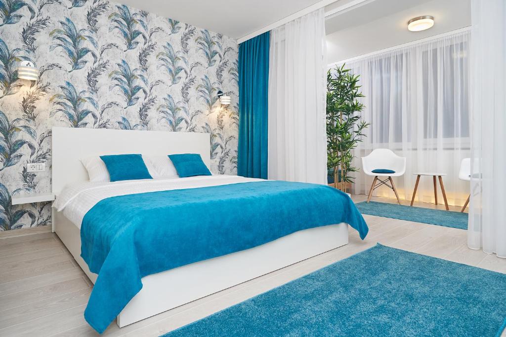 Кровать или кровати в номере Exotic Rami’s Apartments