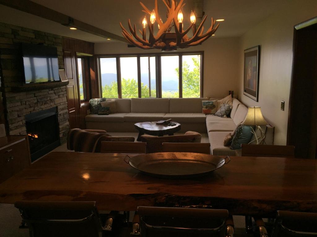 a living room with a couch and a table at Rudow Roost in Beech Mountain