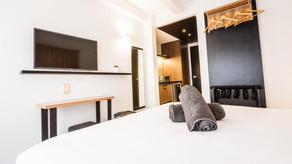 Postel nebo postele na pokoji v ubytování No. 9 Hotel