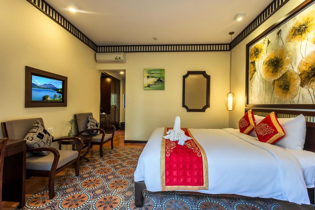 Postel nebo postele na pokoji v ubytování Hoi An Field Boutique Resort & Spa