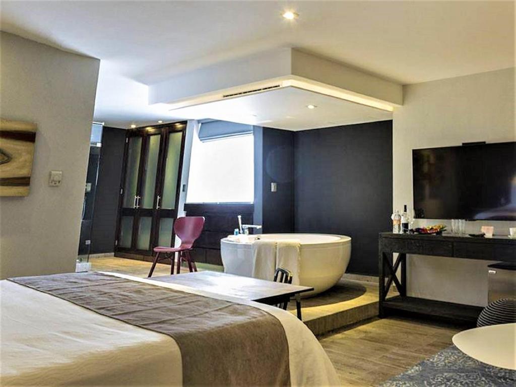 Postel nebo postele na pokoji v ubytování NEhotel Nueva Estancia