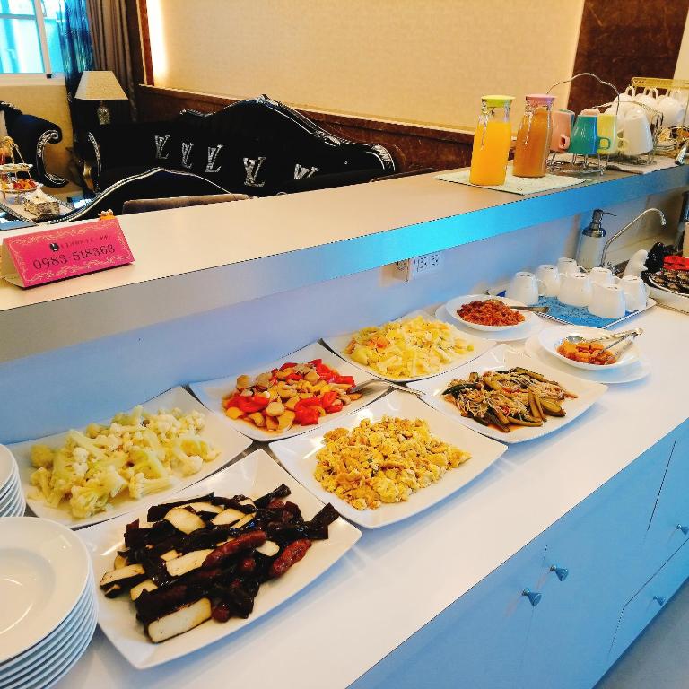 a buffet of different types of food on a table at Taitung Quality B&amp;B in Taitung City