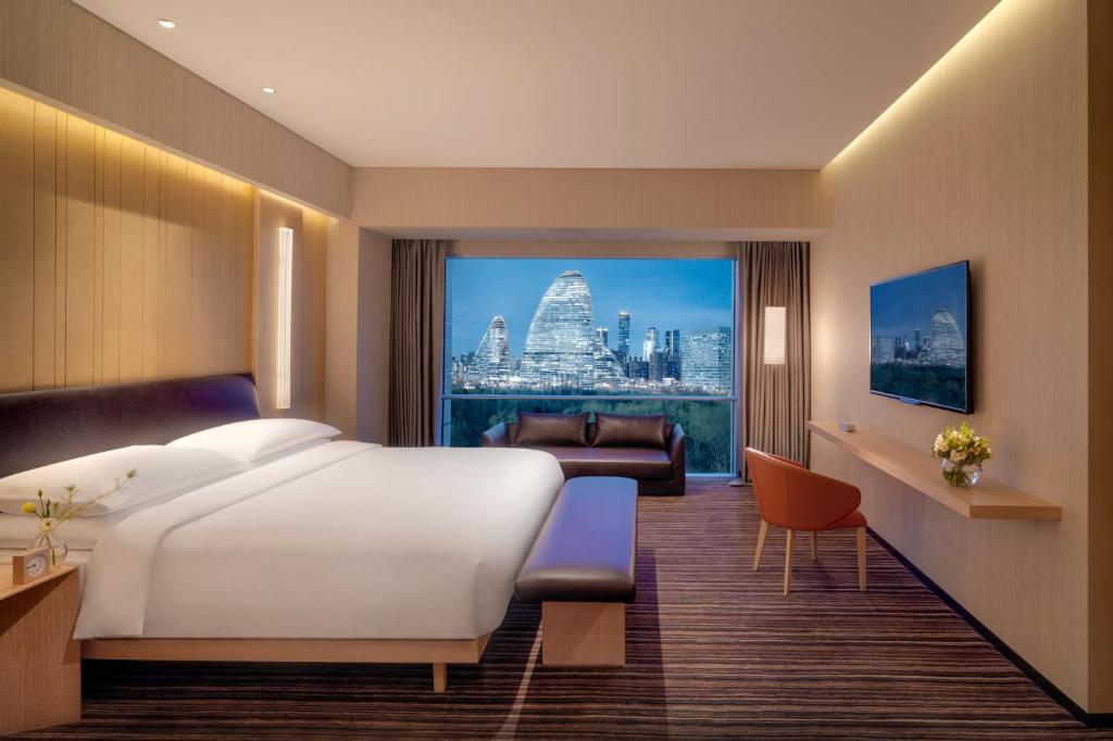 Postel nebo postele na pokoji v ubytování Hyatt Regency Beijing Wangjing