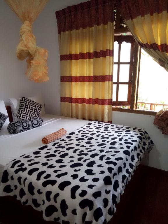 Postel nebo postele na pokoji v ubytování Tunnel Gap Homestay