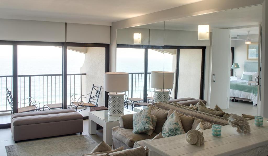 a living room with a couch and a table at 1104 The Bermudas - by Stay in Umhlanga in Durban