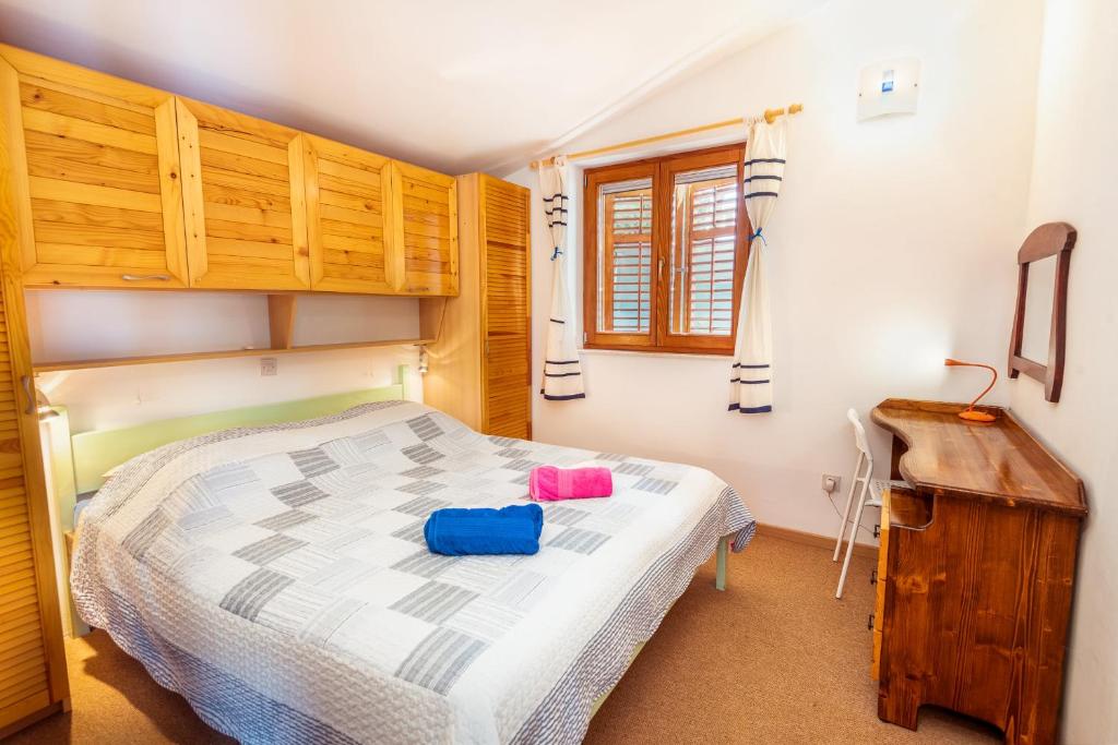 Posteľ alebo postele v izbe v ubytovaní Holiday Home Gluscevic
