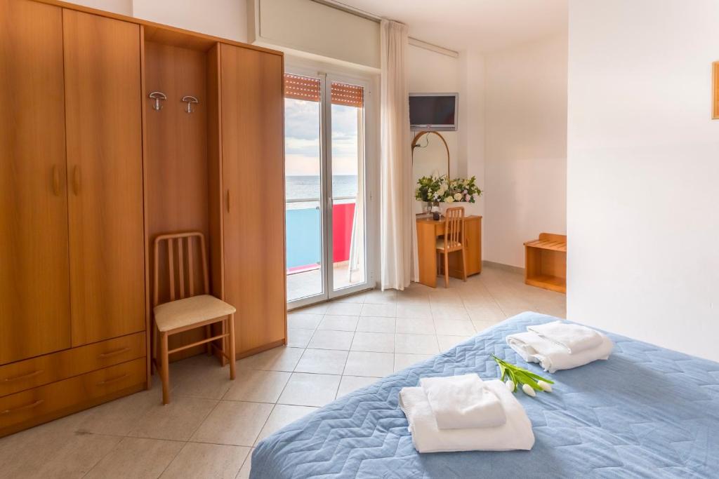 Postel nebo postele na pokoji v ubytování Hotel CasaDei