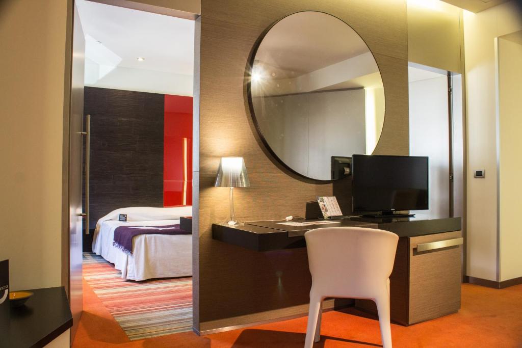 Postel nebo postele na pokoji v ubytování UNA HOTELS T Hotel Cagliari