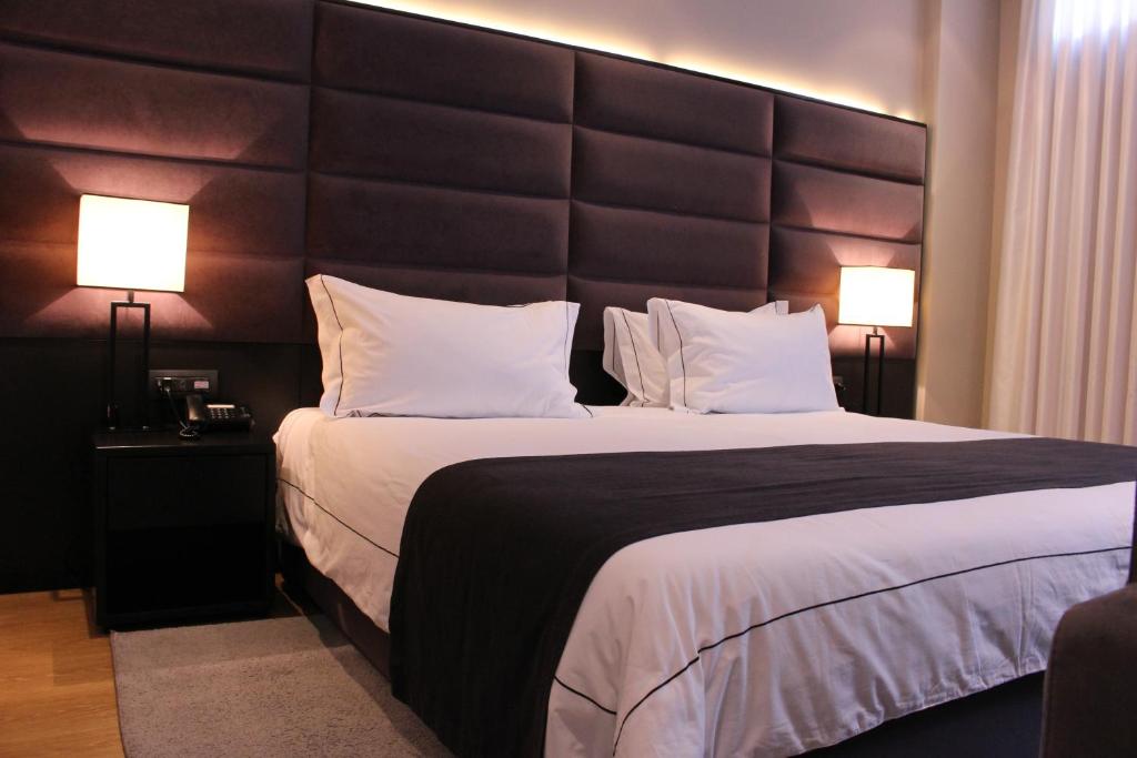 Postel nebo postele na pokoji v ubytování Privilege Hotel & Spa