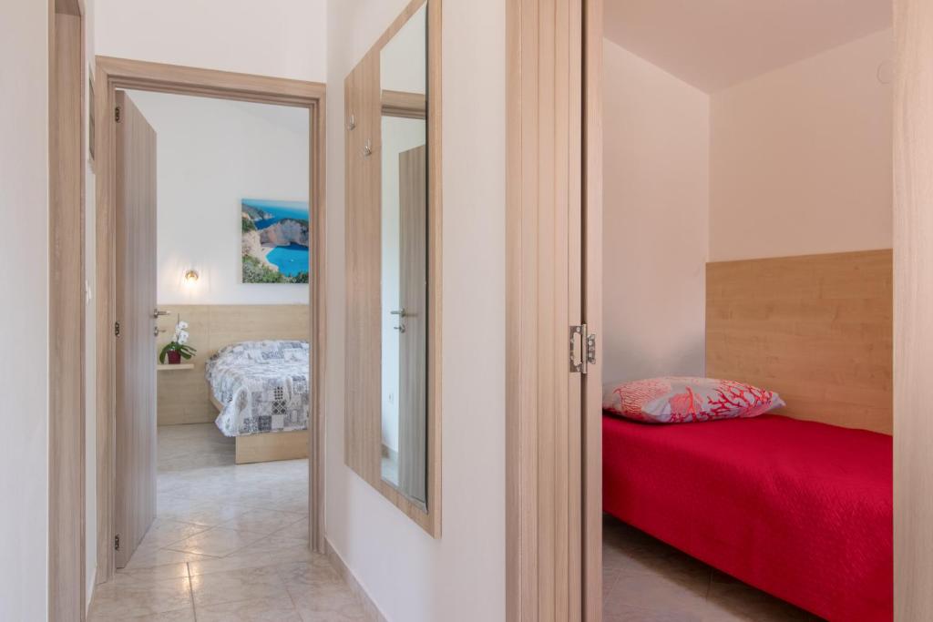 Postel nebo postele na pokoji v ubytování Apartment Taja