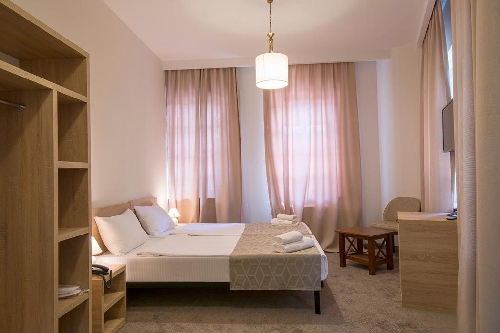 Postel nebo postele na pokoji v ubytování Hotel Opinion