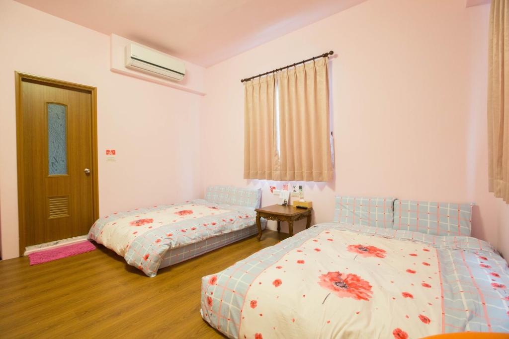 Postel nebo postele na pokoji v ubytování Sen Yun Chuang Yuan Homestay NO1249
