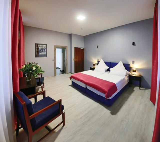 Postel nebo postele na pokoji v ubytování Hotel Am Markt