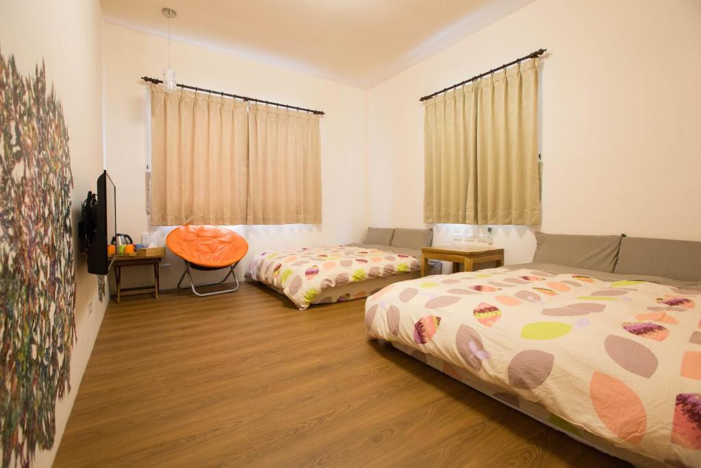 Postel nebo postele na pokoji v ubytování Sen Yun Chuang Yuan Homestay NO1249