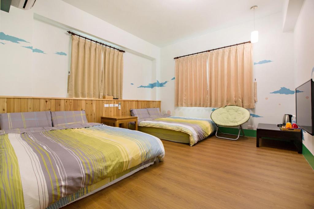 Postel nebo postele na pokoji v ubytování Sen Yun Chuang Yuan Homestay NO1249
