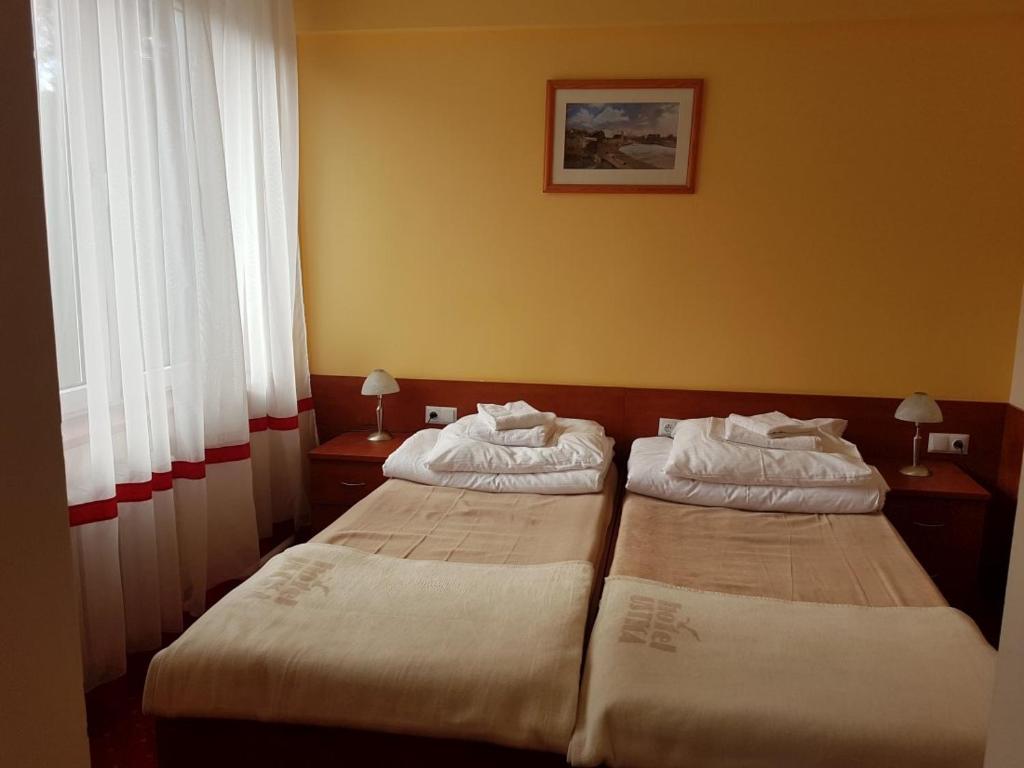 Postel nebo postele na pokoji v ubytování Hotel Ustka