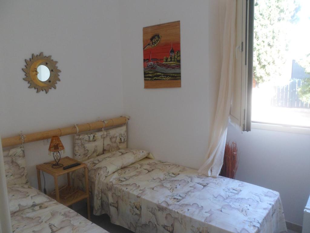 Postel nebo postele na pokoji v ubytování Attico a 150 mt dal mare
