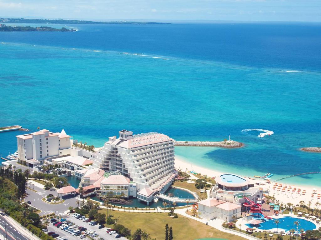 an aerial view of a resort and the ocean at Sheraton Okinawa Sunmarina Resort in Onna