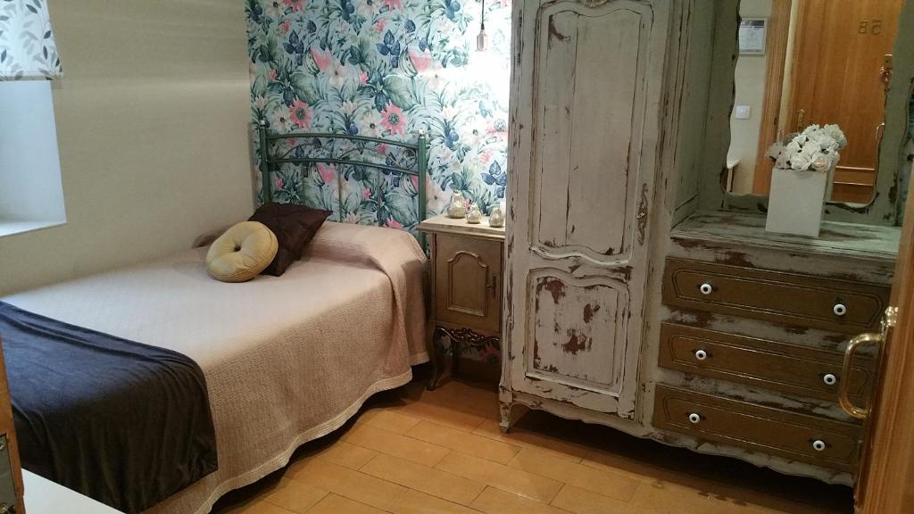 Łóżko lub łóżka w pokoju w obiekcie Hosteria Villa de Castro