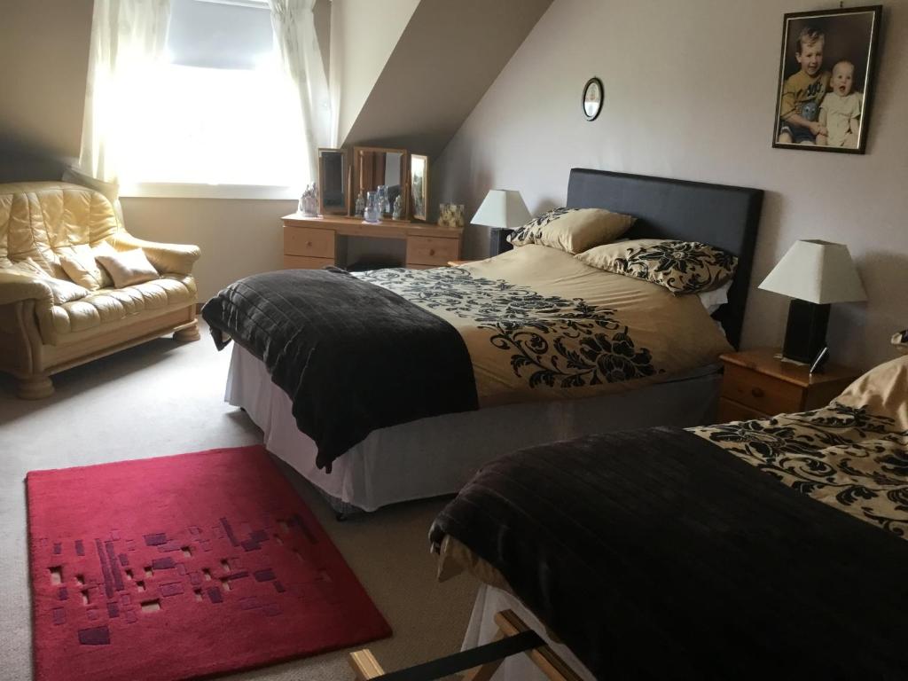 Postel nebo postele na pokoji v ubytování Woodcockfaulds House