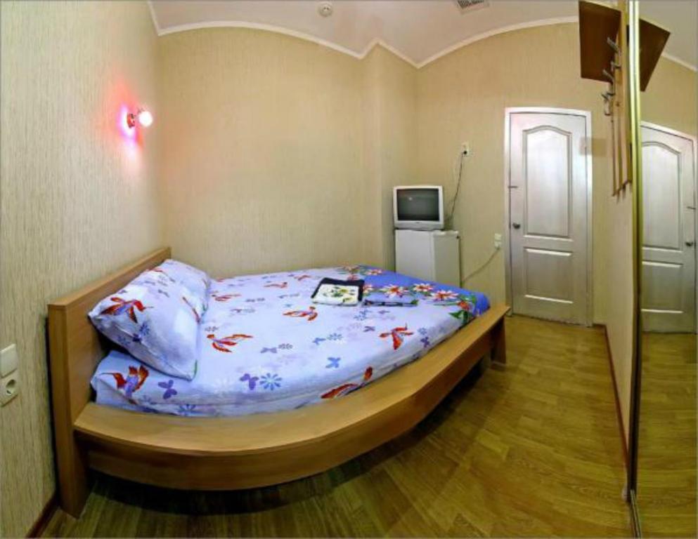 Postel nebo postele na pokoji v ubytování HOTEL ЗiРКА