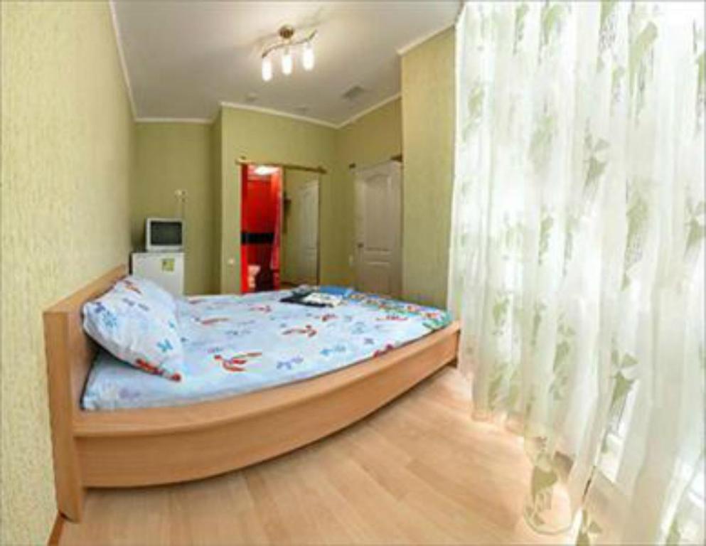 Postel nebo postele na pokoji v ubytování HOTEL ЗiРКА