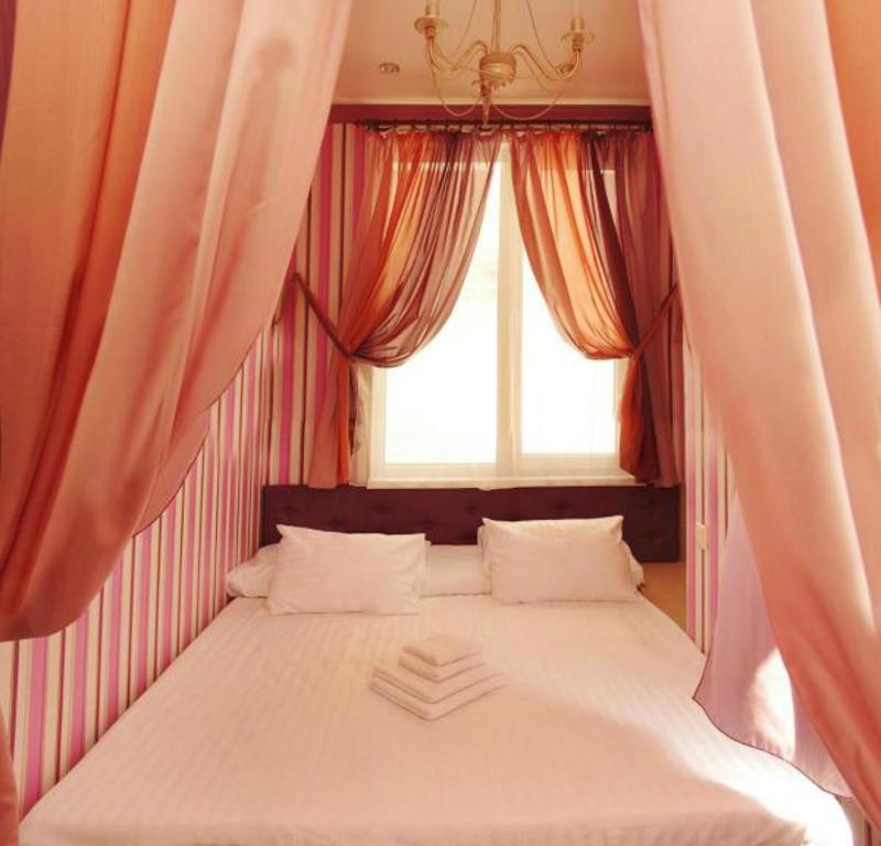 Postel nebo postele na pokoji v ubytování HOTEL ЗiРКА