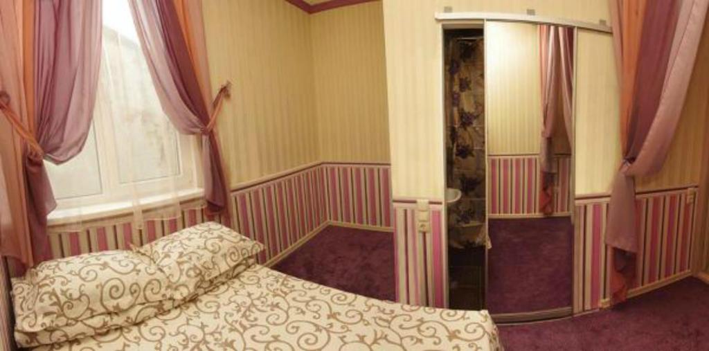 Postel nebo postele na pokoji v ubytování HOTEL ЗiРКА