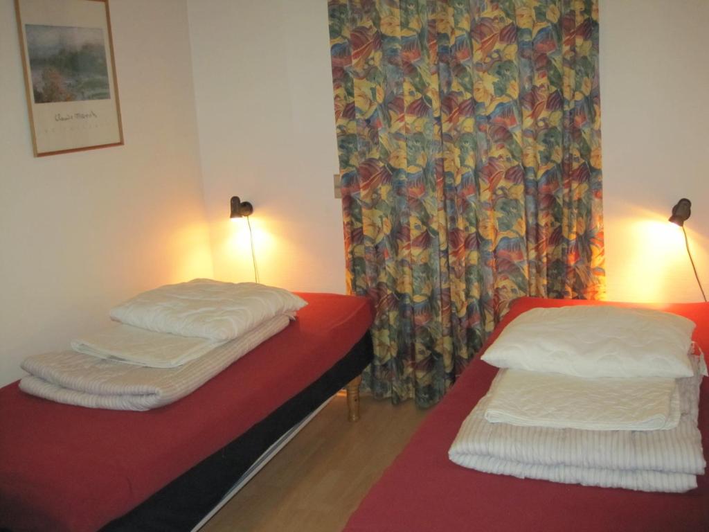 Postel nebo postele na pokoji v ubytování Silkeborg Sø Camping Apartments