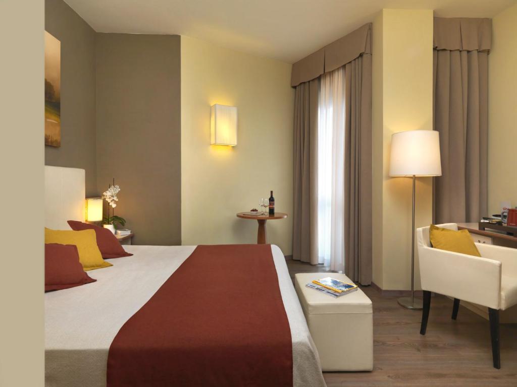 Postelja oz. postelje v sobi nastanitve Hotel Ristorante Alcide