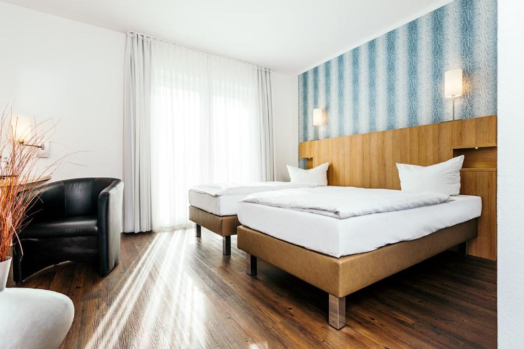 Postel nebo postele na pokoji v ubytování Hotel Westerkamp