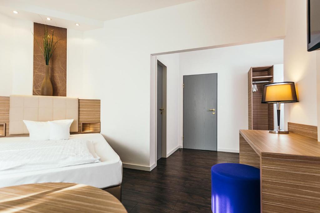 Postel nebo postele na pokoji v ubytování Hotel Westerkamp