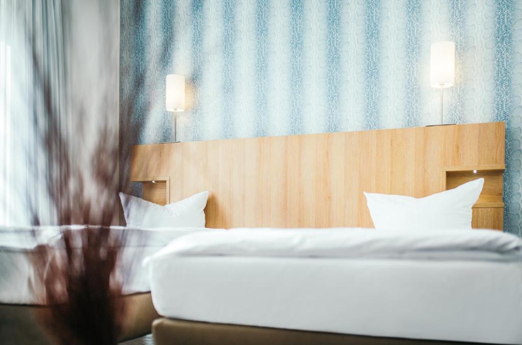 Postel nebo postele na pokoji v ubytování Hotel Westerkamp