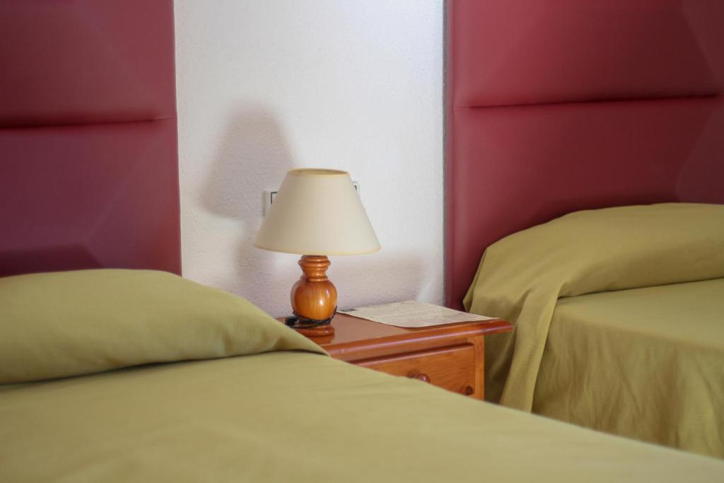 Postel nebo postele na pokoji v ubytování Hostal Esperanza