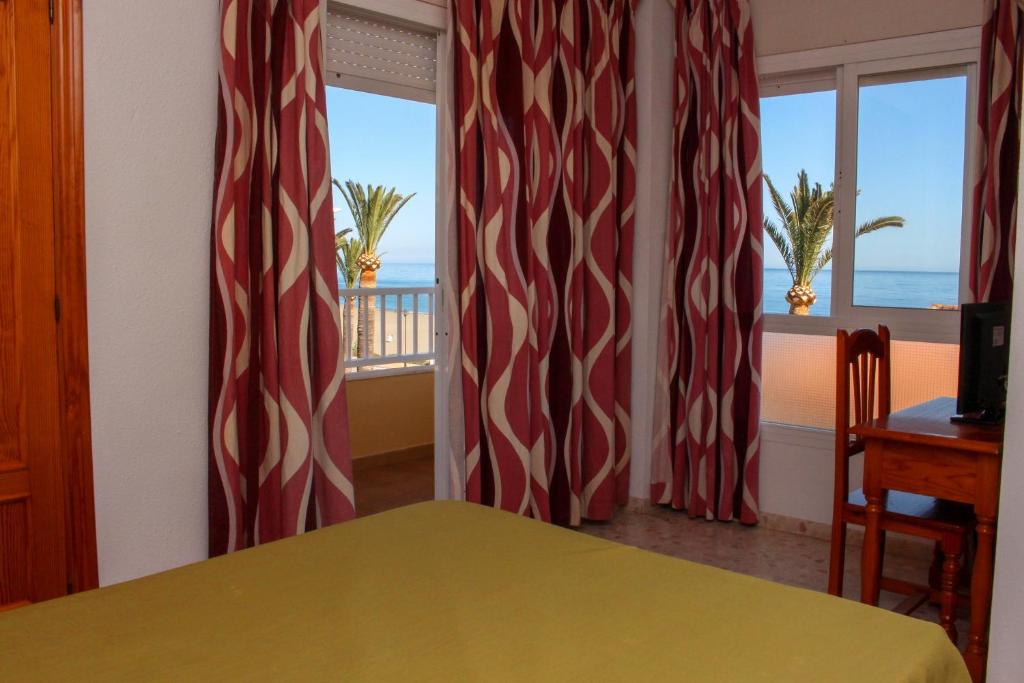 Postel nebo postele na pokoji v ubytování Hostal Esperanza