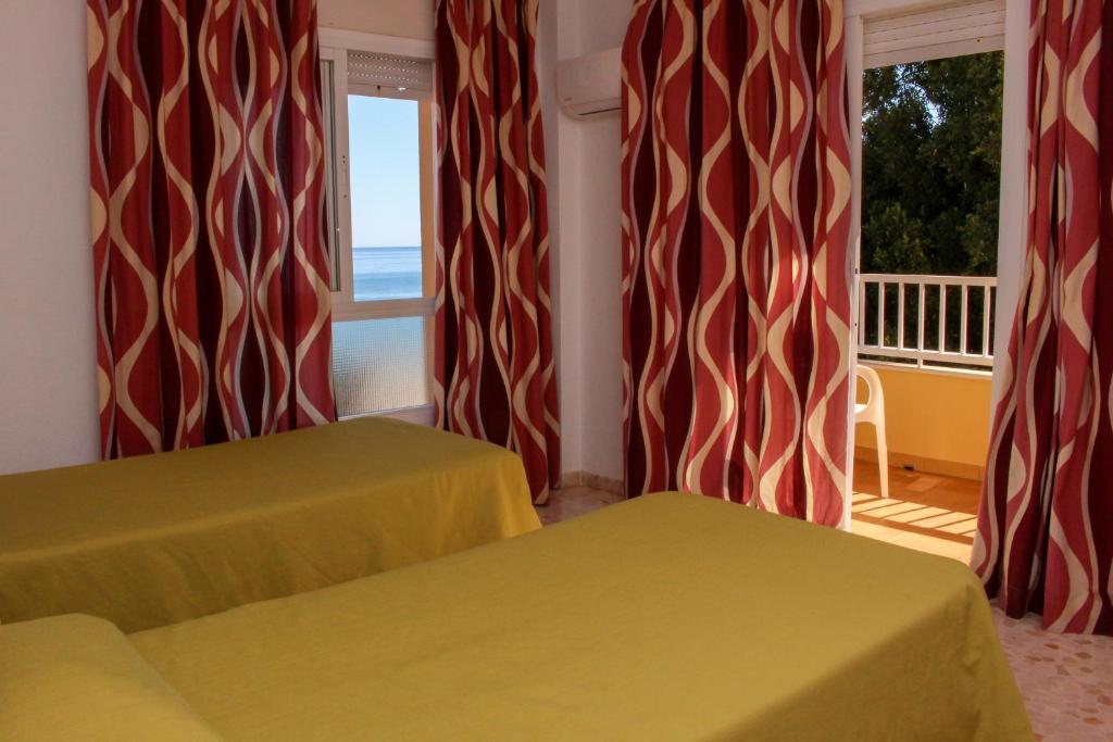 Postel nebo postele na pokoji v ubytování Hostal Esperanza