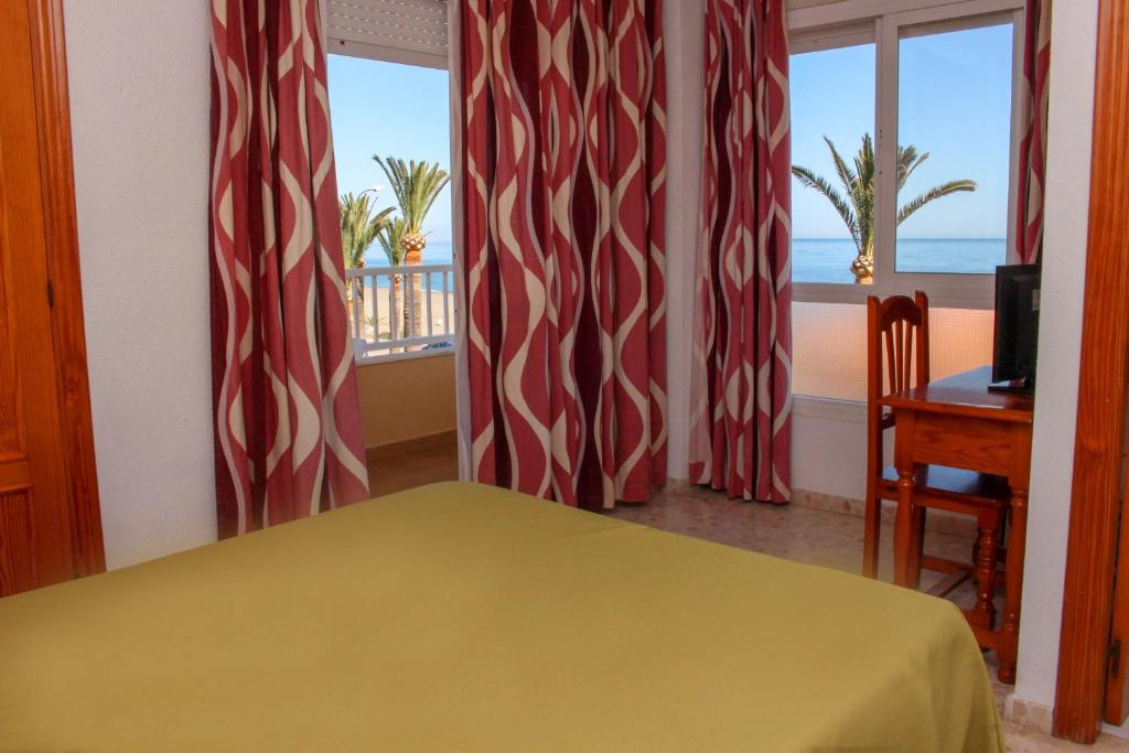 Postel nebo postele na pokoji v ubytování Hostal Esperanza