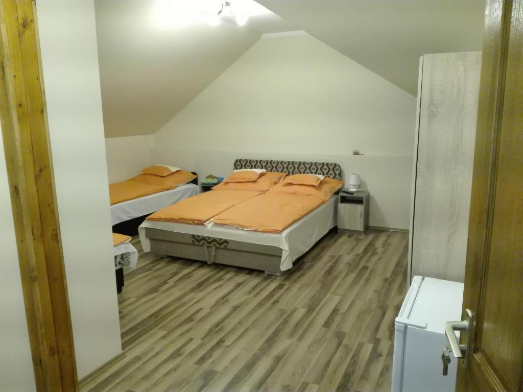 Postel nebo postele na pokoji v ubytování Rita Apartman