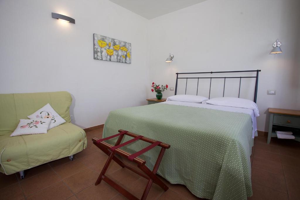 A bed or beds in a room at Bio Agriturismo Il Torrione