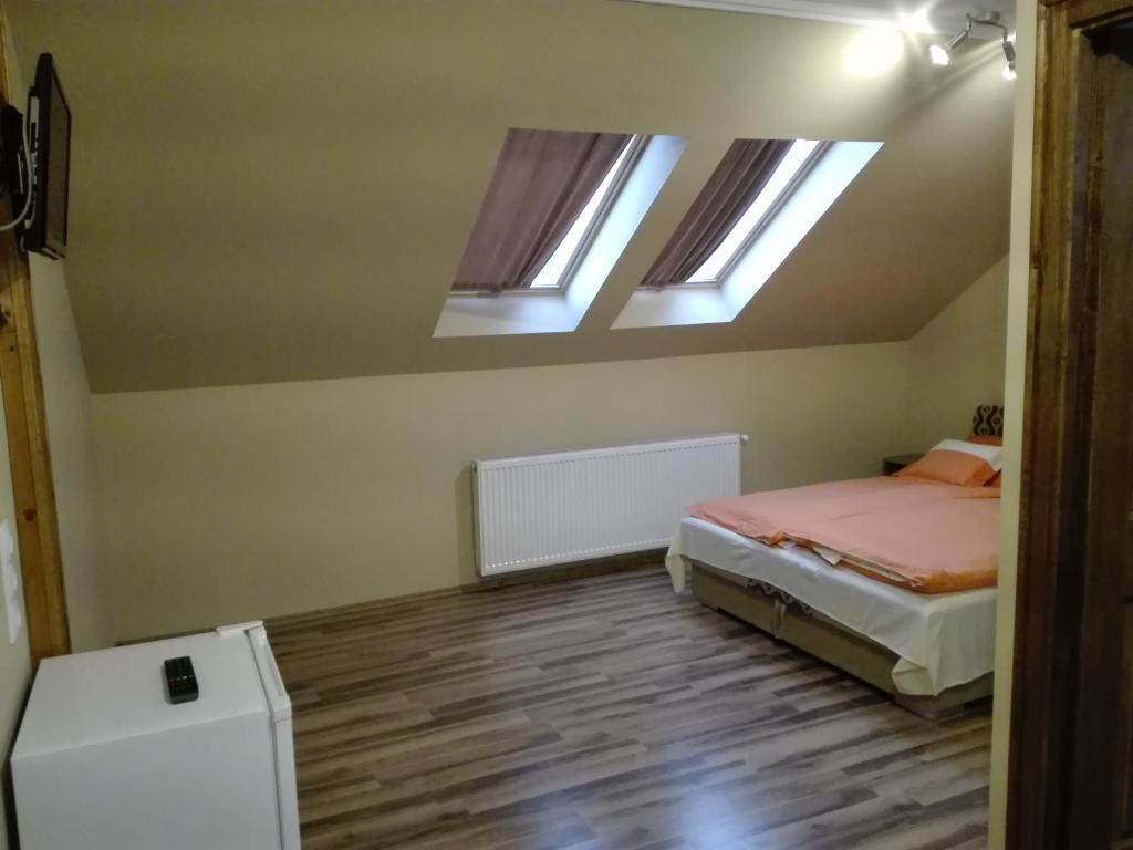 Postel nebo postele na pokoji v ubytování Rita Apartman