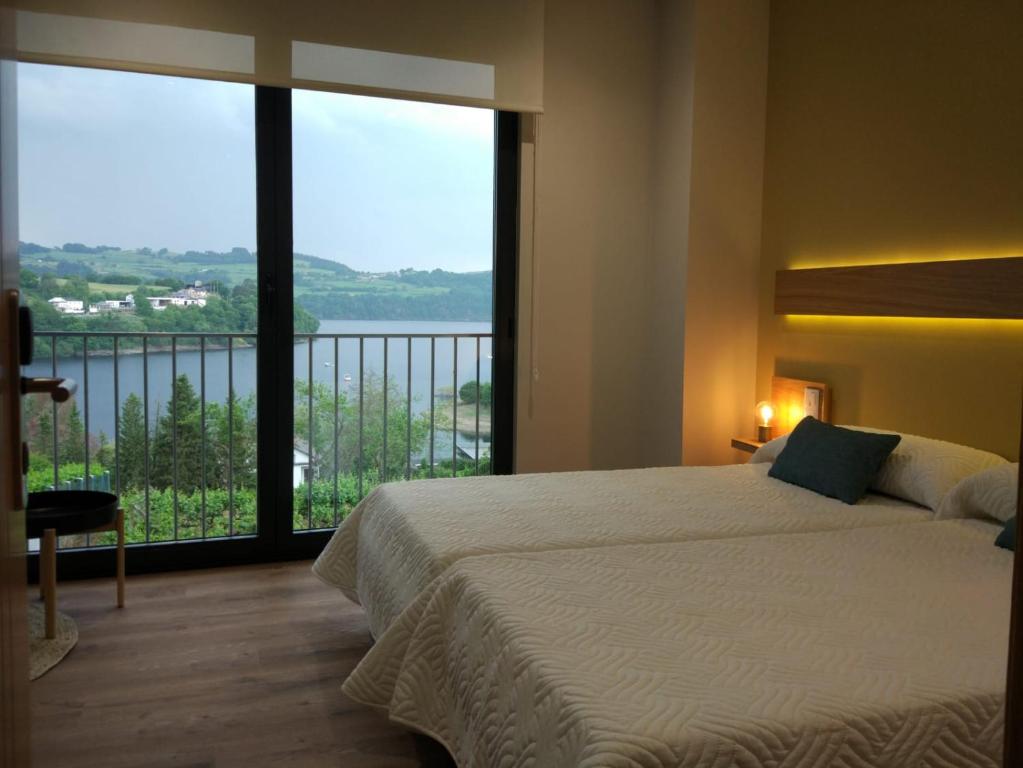 Posteľ alebo postele v izbe v ubytovaní Casona da Ponte