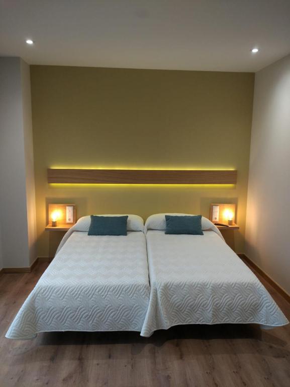 Posteľ alebo postele v izbe v ubytovaní Casona da Ponte