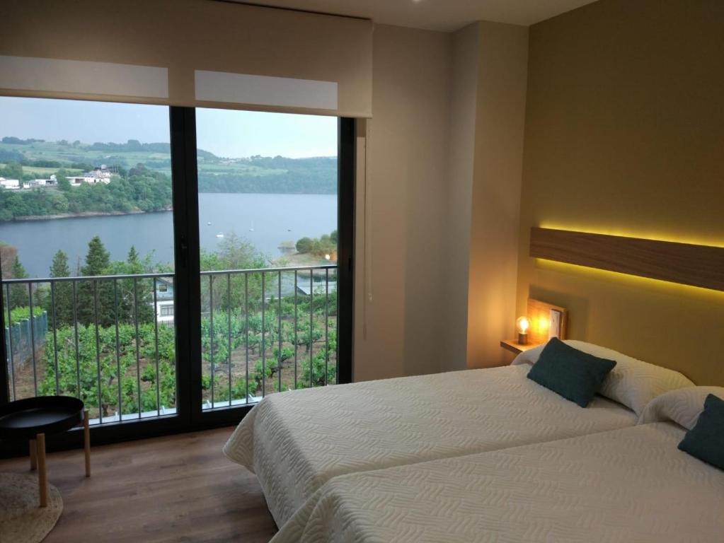 Posteľ alebo postele v izbe v ubytovaní Casona da Ponte