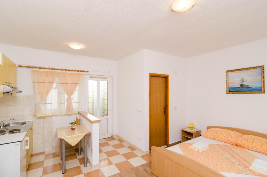 Łóżko lub łóżka w pokoju w obiekcie Apartments Skurla