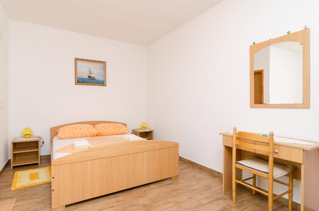 Łóżko lub łóżka w pokoju w obiekcie Apartments Skurla